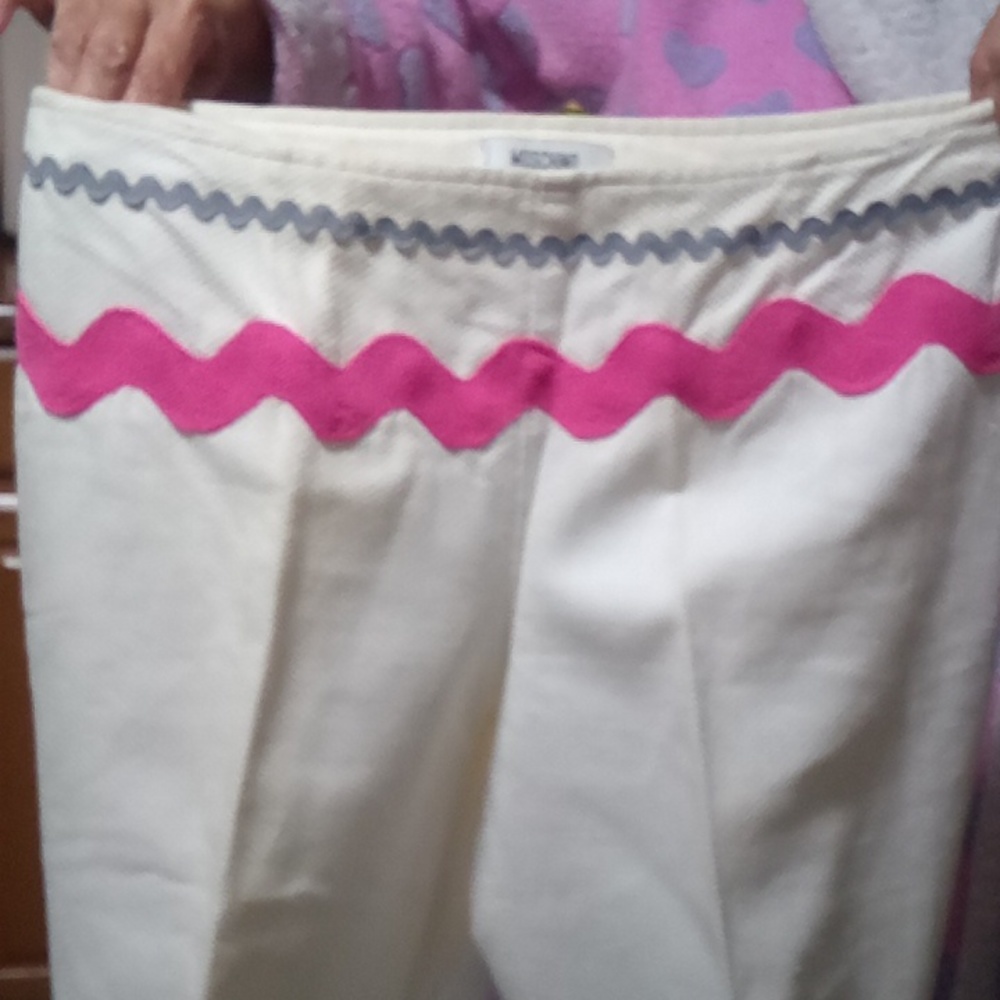 White with pink and blue decorative stitching slacks by Moschino